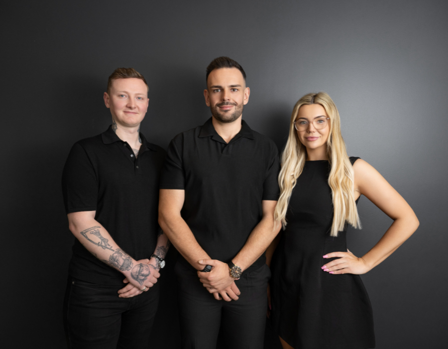 The Hayes Financial team in front of a dark background